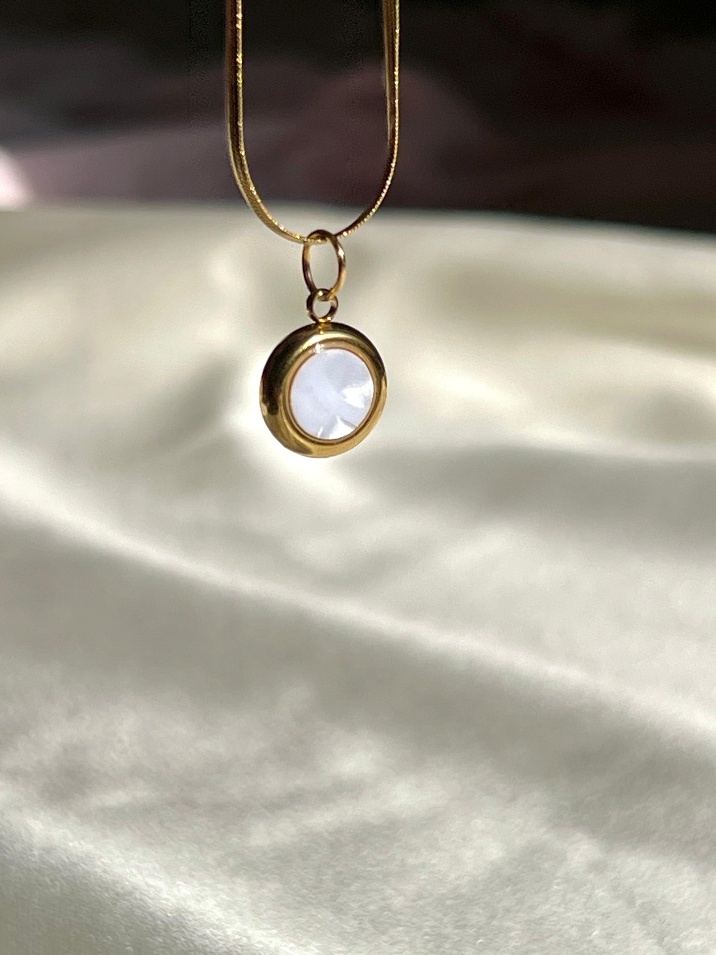 Gold necklace with a round pendant, elegant, handmade
